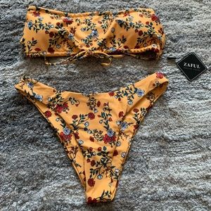 Brand new bathing suit with tags, Size Medium.